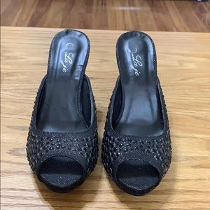 Black stone covered shiny heel